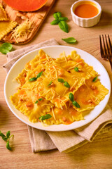 Homemade Pumpkin Ravioli with ricotta cheese served basil