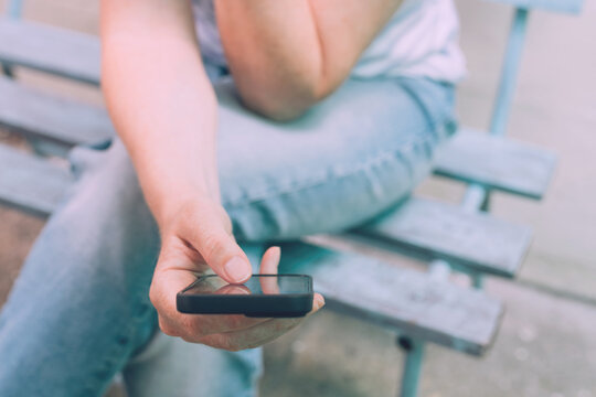 Fear Of Missing Out (Fomo) Concept, Closeup Of Female Hands Using Mobile Smart Phone