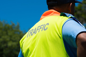 traffic cop dressed in uniform with high visibility vest or jacket closeup concept road safety in...