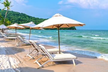 Sunbeds on tropical beach in Phu Quoc island, Vietnam. Beach's smile