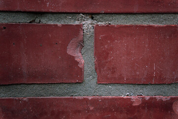 close-up of an aged wall made with old red bricks