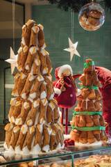 Nice christmas tree made vith sicilian cannoli, typical sweet italian food filled with cheese and candied oranges