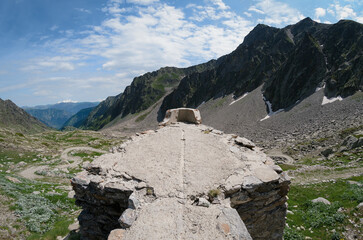 Ruins of the second world war italian military barracks and guardhouse near the pass of of San Bernolfo and Colle Lounge, hiking path between the french Alps and Piedmont (Italy)