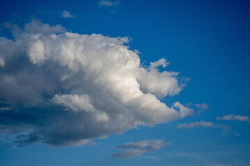 Dramatic blue sky with white clouds.