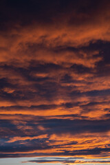 Sunset sky with orange clouds. Nature background.
