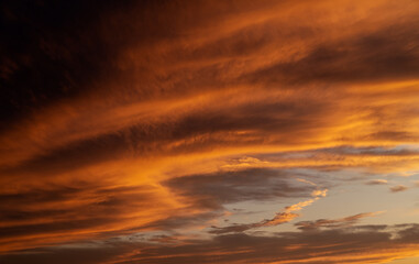 Naklejka na ściany i meble Sunset sky with orange clouds. Nature background.