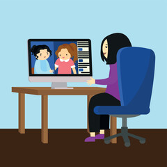 The girl at the desk communicates via video link on the computer