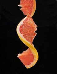 DNA Food, Grapefruit - GMO modified fruit isolated on black Background