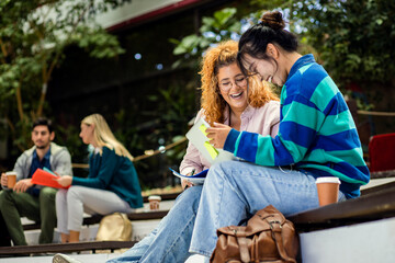 Group of student siting in campus learning together.