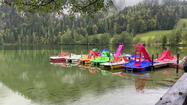 colourful pedal boats at alpine lake