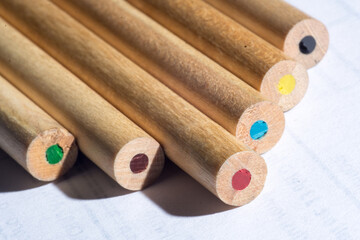 group of colored wooden pencils for freehand drawing on white background