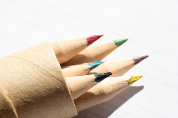 group of colored wooden pencils for freehand drawing on white background