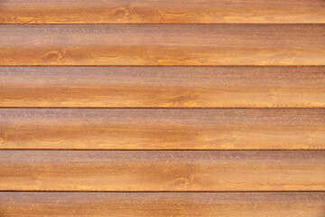 Fototapeta premium Facade cladding from solid wood handmade boards in brown color