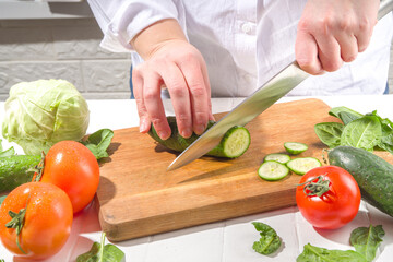 Close-up of cutting cucumbers