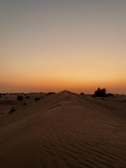 Fototapeta na wymiar Beautiful sunset above desert dunes