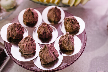 Delicious wedding reception. Candy bar for banquet. Celebration birthday concept. Trendy desserts. Table with sweets, candies. Close up.