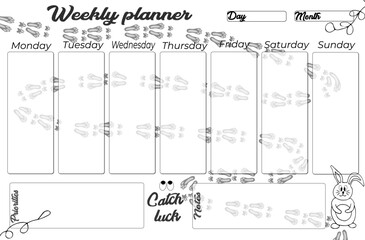 Planner, organizer decorated with the symbol of the year 2023 rabbit, rabbit tracks with motivational lettering, text