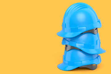 Stack of safety helmets or hard caps for carpentry work on yellow background