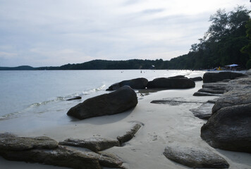 Rocks on the beach with blue sky