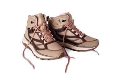 A pair of sports shoes for hiking on a white isolated background.