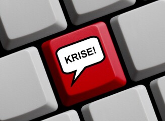 Krise online - Sprechblase auf Computer Tastatur