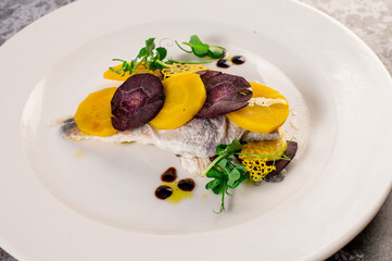 Dish of white fish with vegetables and herbs. Healthy food