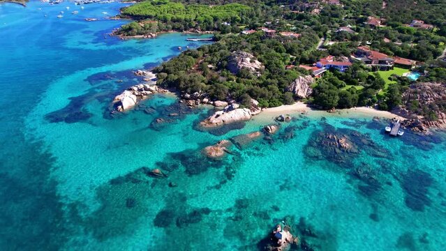 Sardegna island best beaches in aerial drone video of  Elefant beach with turquoise sea and rock formations . Italy summer holidays
