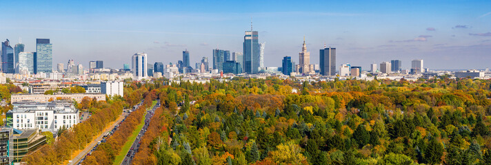Autumn in Warsaw, colorful forest and distant city center aerial view