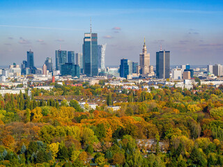 Autumn in Warsaw, colorful forest and distant city center aerial view - obrazy, fototapety, plakaty