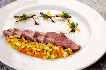 Dish of duck meat with vegetables and herbs. Healthy food