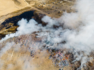 Fototapeta na wymiar Aerial view of landfill with burning trash piles