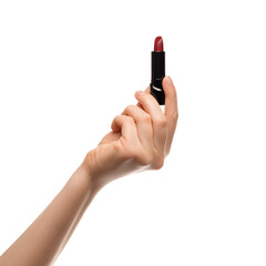 Red lipstick in a woman's hand on a white background, isolated.