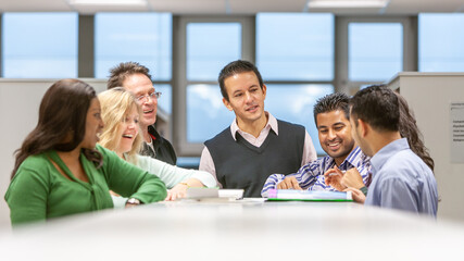 Adult Education: Study Group. A group of mature students working together with their teacher in class. From a series of related images on the subject.