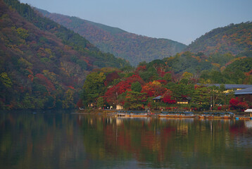 Service Boats on the river in Arashiyama Park with Autumn season, Kyoto, Japan.