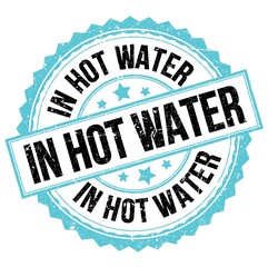 IN HOT WATER text on blue-black round stamp sign