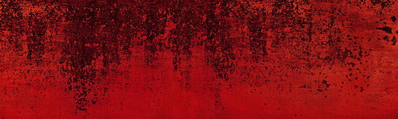 Old peeling bright red paint surface wide texture. Scarlet color gloomy grunge abstract panoramic background