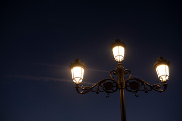 old pedestrian street lamps at night