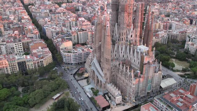 Sunrise drone aerial of the Basilica Sagrada Familia, the iconic church has been in construction for over a century but is scheduled for completion in 2026.