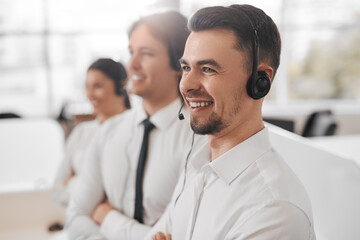 Cheerful male and female coworkers smiling in office