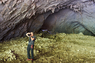 Nature photographer shooting in a cave
