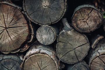 Aged balks. Wooden background. Rustic style. Old rough pile of tree bars different size with cracks and gaps copy space.