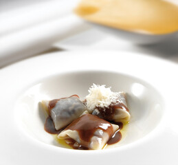Saquitos rellenos de morcilla con queso parmesano. Sachets stuffed with black pudding with Parmesan...