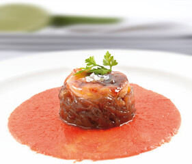 Red tuna on a tomato background, tartare. Red tuna on a tomato background, tartare. - obrazy, fototapety, plakaty