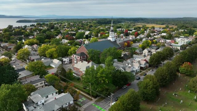 New England aerial with lark and autumn fall leaves. Colorful foliage. Quintessential aerial of USA town.