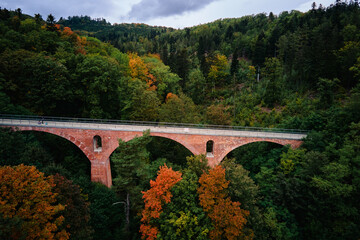 Fototapeta na wymiar Railway viaduct in Srebrna gora at autumn season. Poland landmark for tourists. Beautiful nature landscape