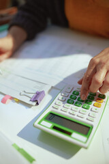 accountant woman with calculator and documents working