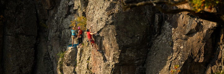 Rock climbers. Active lifestyle, risky hobbies, dangerous adrenaline sports background. Group of...