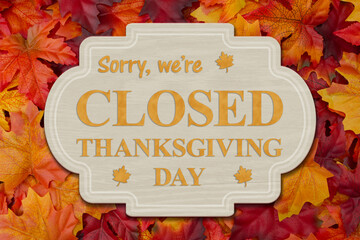 Closed Thanksgiving Day sign with fall leaves