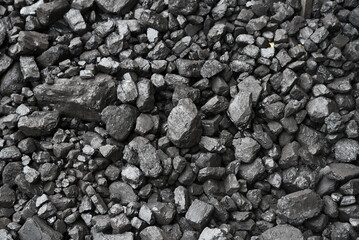 The texture of pieces of coal lying on top of each other.