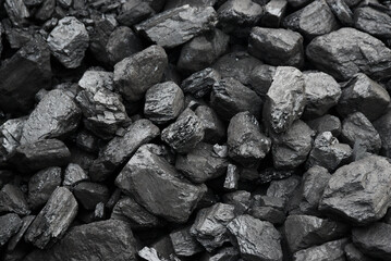 The texture of pieces of coal lying on top of each other.